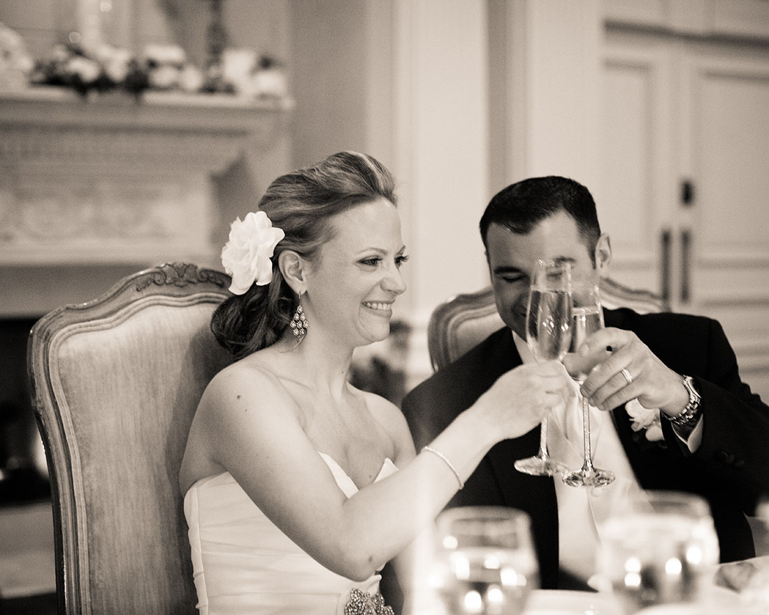 Bride and groom toasting with champagne at an elegant black tie wedding at the Park Savoy, Florham Park, NJ by Laura Billingham Photography