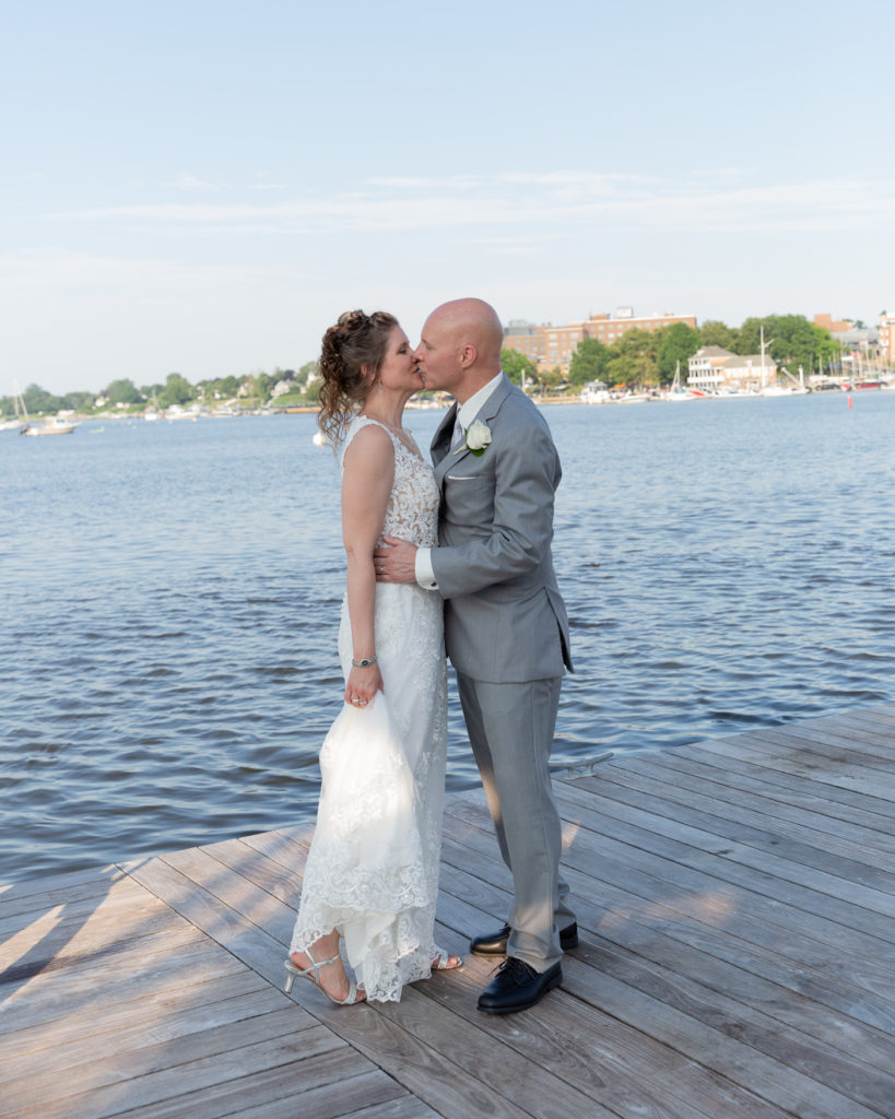 Elegant bride and groom on the Marina at the Molly Pitcher Inn in Red Bank, NJ by wedding photographer Laura Billingham