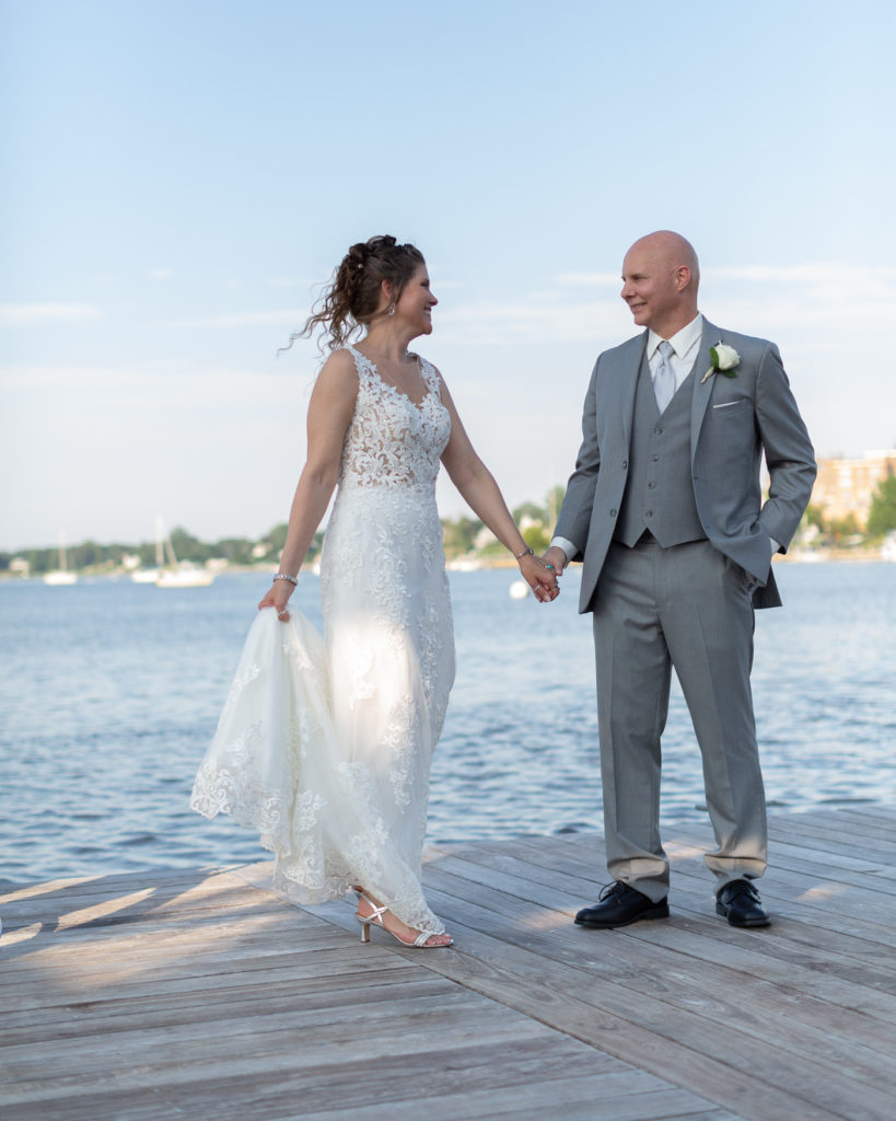 Elegant bride and groom on the Marina at the Molly Pitcher Inn in Red Bank, NJ by wedding photographer Laura Billingham