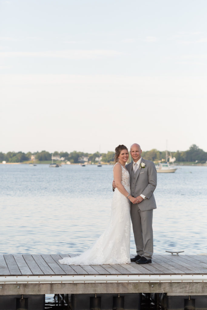 Elegant bride and groom on the Marina at the Molly Pitcher Inn in Red Bank, NJ by wedding photographer Laura Billingham