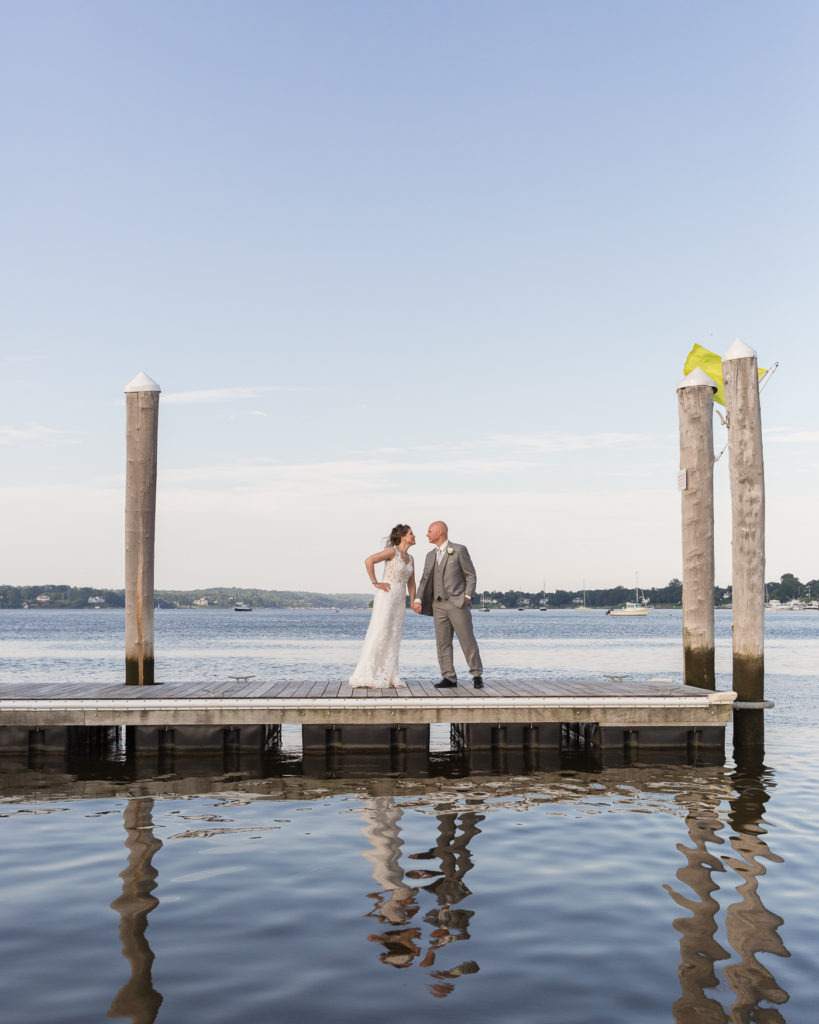 Elegant bride and groom on the Marina at the Molly Pitcher Inn in Red Bank, NJ by wedding photographer Laura Billingham