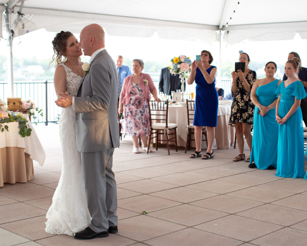 Elegant bride and groom enjoy their first dance under the reception tent at the Molly Pitcher Inn in Red Bank, NJ photographed by Laura Billingham