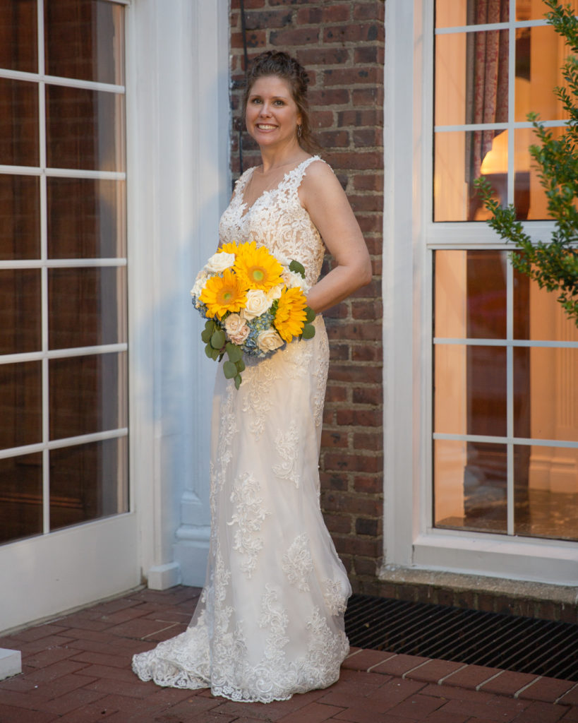 Elegant bridal portrait in front of the Molly Pitcher Inn in Red Bank, NJ by wedding photographer Laura Billingham