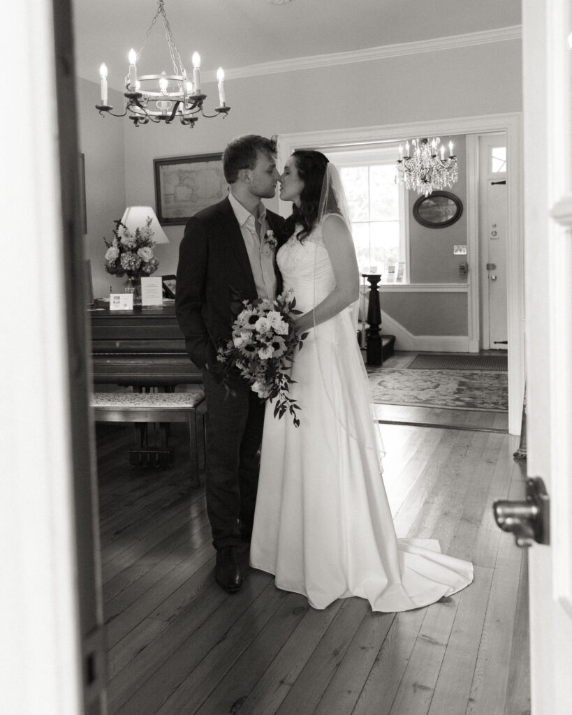 bride and groom share a moment alone after their rustic chic ceremony at the Woolverton Inn, wedding photography by Laura Billingham