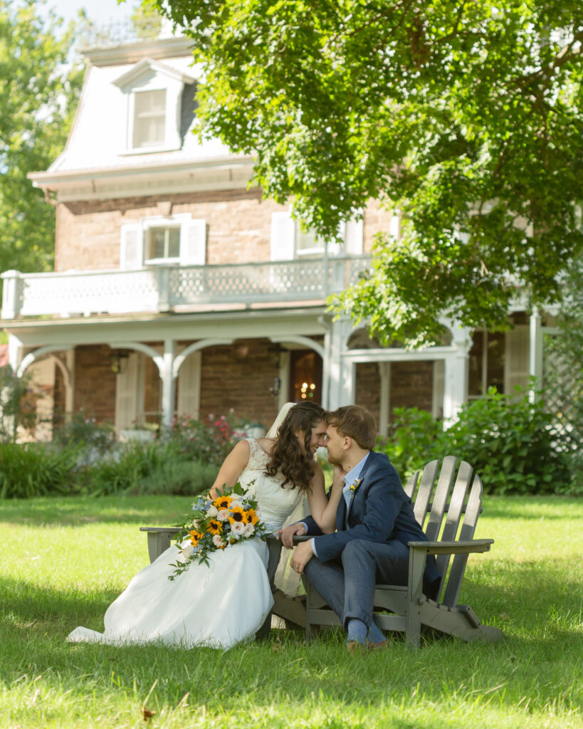 elegant bride and groom kiss at the Woolverton Inn, Stockton, NJ. Wedding photography by Laura Billingham