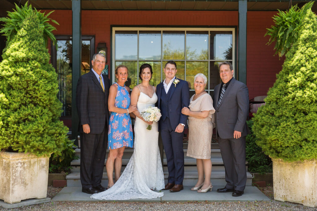 Family portrait with bride and groom in front of Bridgeton House on the Delaware photo by Laura Billingham Photography