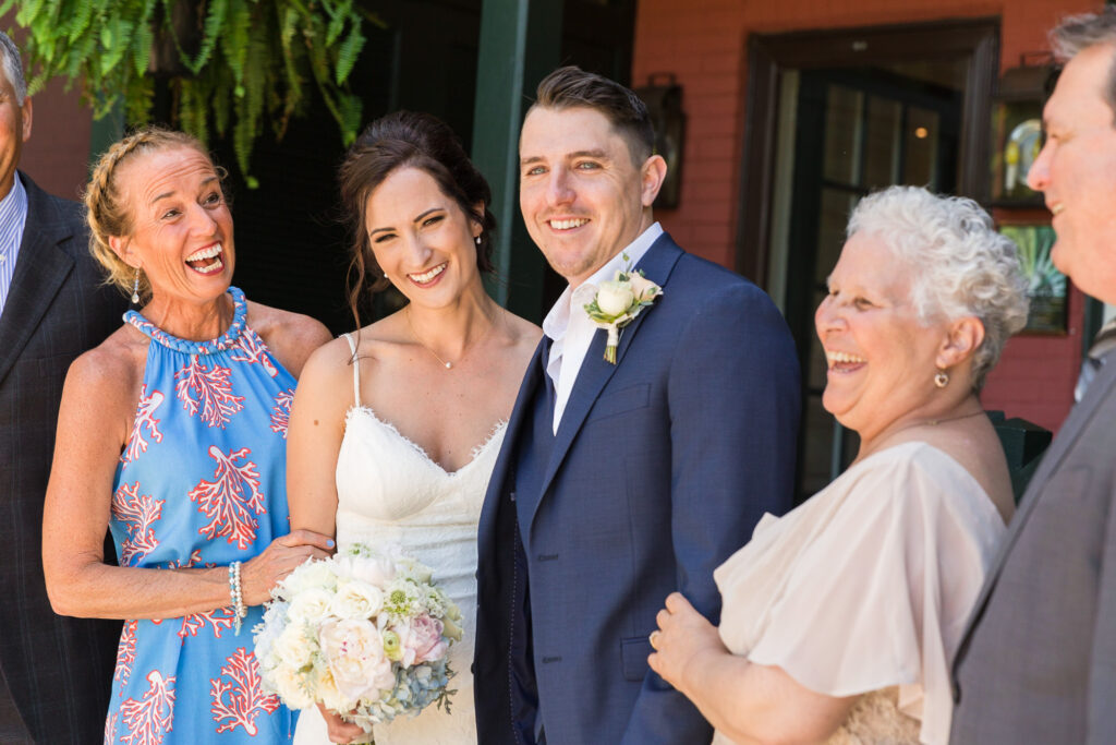 Candid family portrait with elegant bridge and groom at Bridgeton House on the Delaware by Laura Billingham Photography