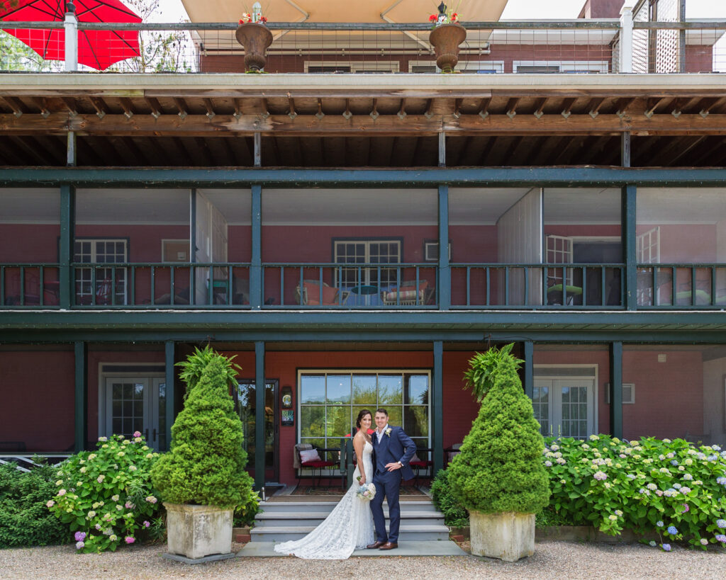 elegant portrait of a bride and groom in front of Bridgeton House on the Delaware photo by Laura Billingham Photography