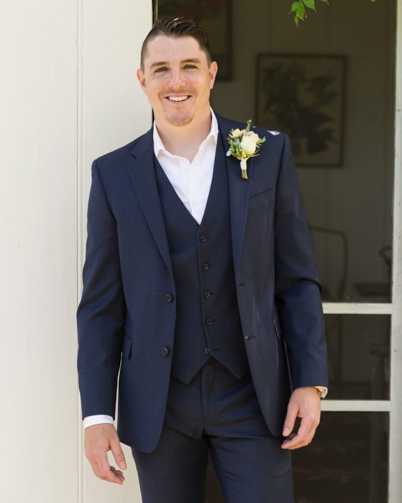 Elegant groom at Bridgeton House on the Delaware photographed by Laura Billingham