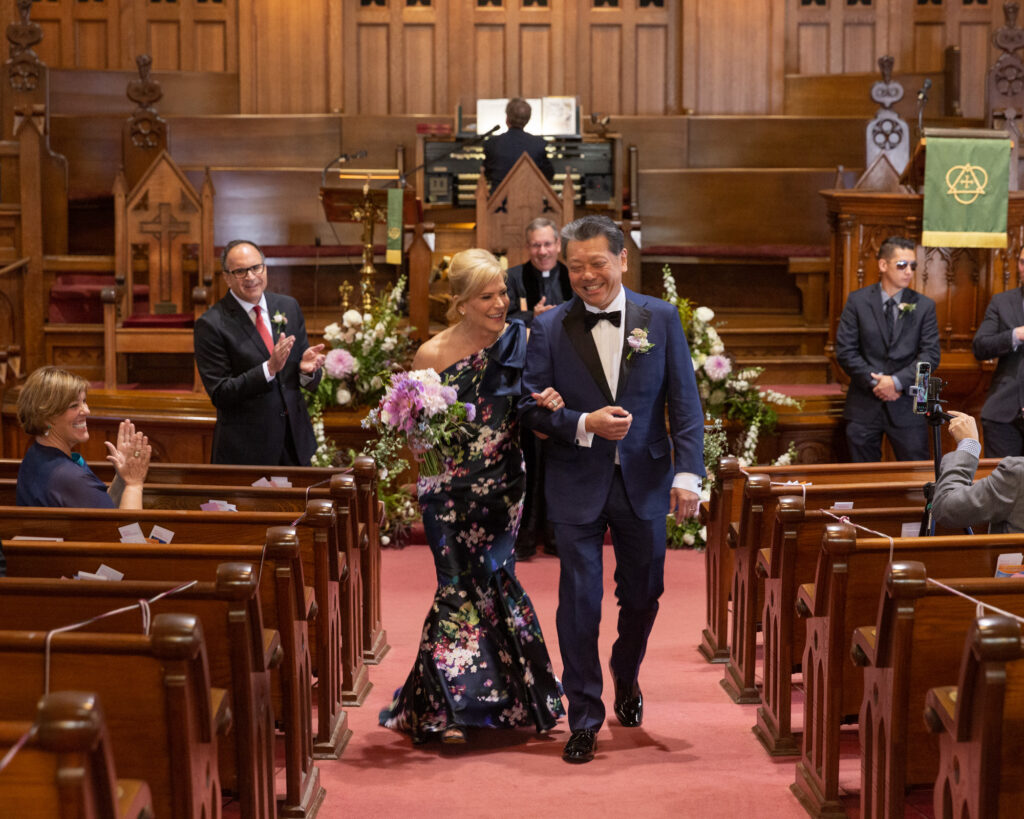 elegant bride and groom walking down the aisle after saying their vows at the Flemington Presbyterian Church in Flemington, NJ by Laura Billingham Photography