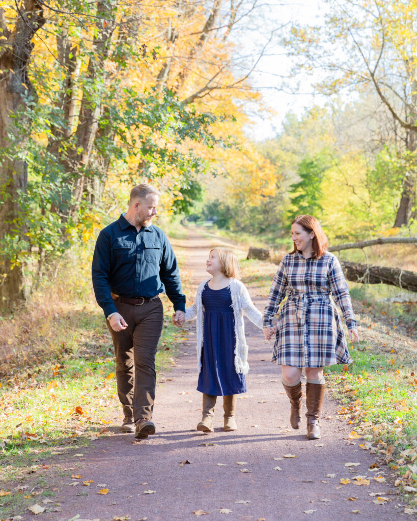 Portrait of a family walking in fall on the canal tow path in Tinicum Park, Erwinna, Bucks County, PA by Laura Billingham Photography