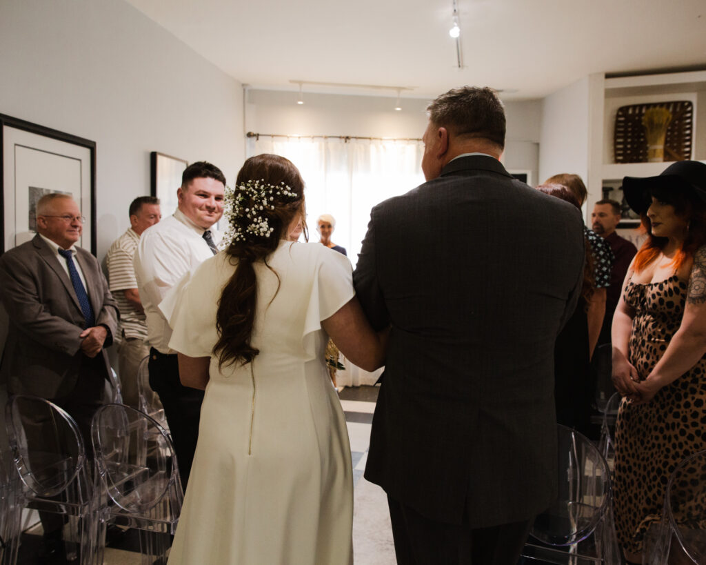 Father of the bride walks bride to the altar before a micro wedding ceremony at 15 Landsdowne in Frenchtown, NJ photographed by Laura Billingham