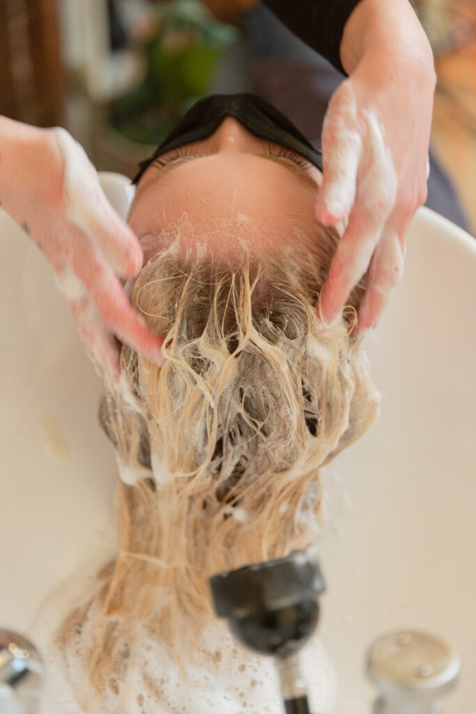 branding photography of luxury hair salon stylist at work