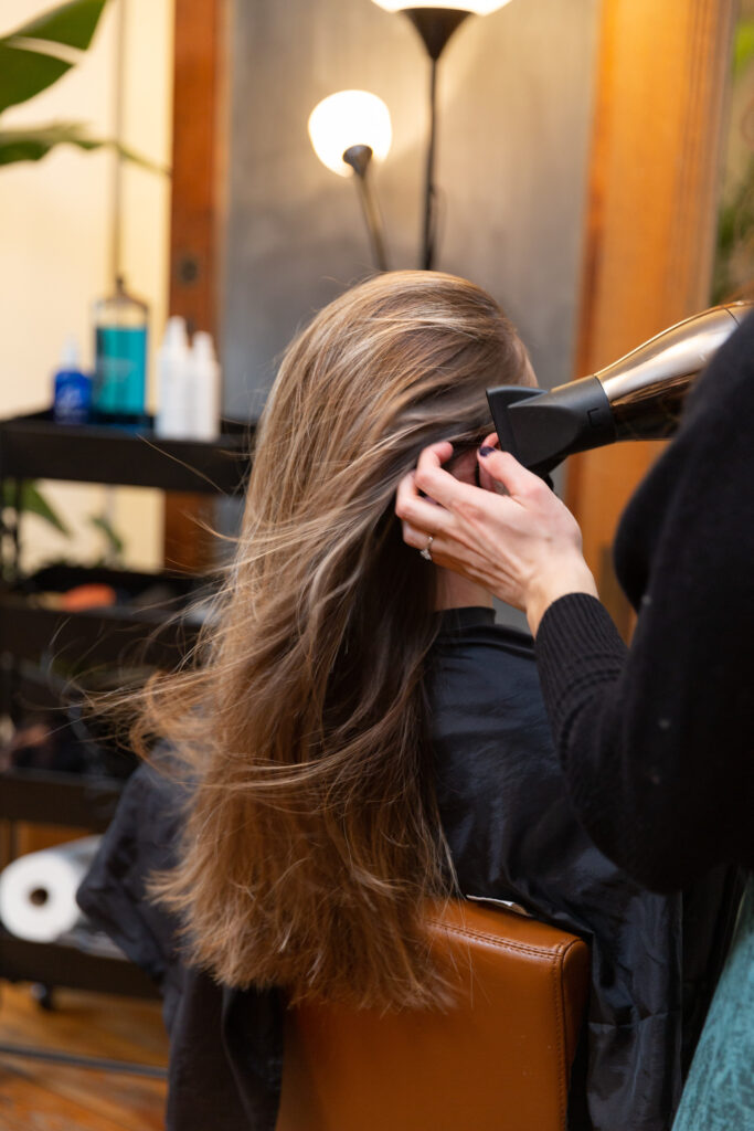 branding photography of luxury hair salon stylist at work