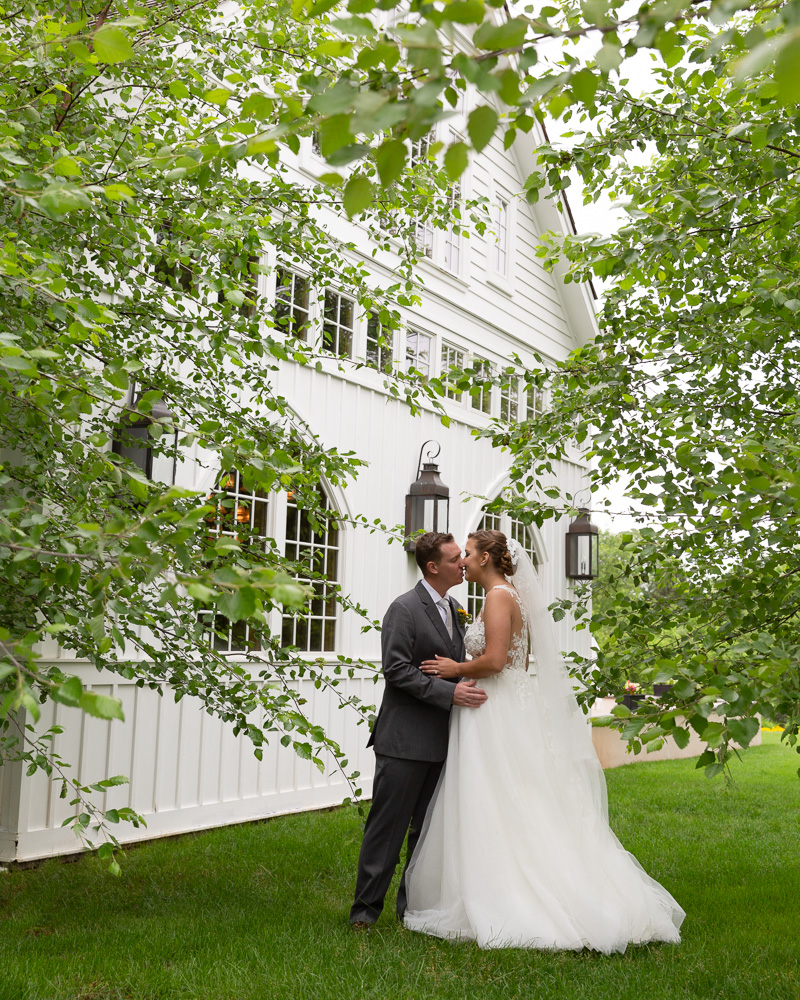 Elegant bride and groom share a first look at the Coach House at the Ryland Inn in Whitehouse Station, NJ by Laura Billingham Photography