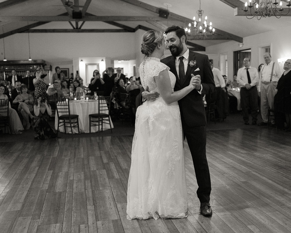 black and white photo of elegant bride and groom during their first dance at HollyHedge Estate in New Hope, PA