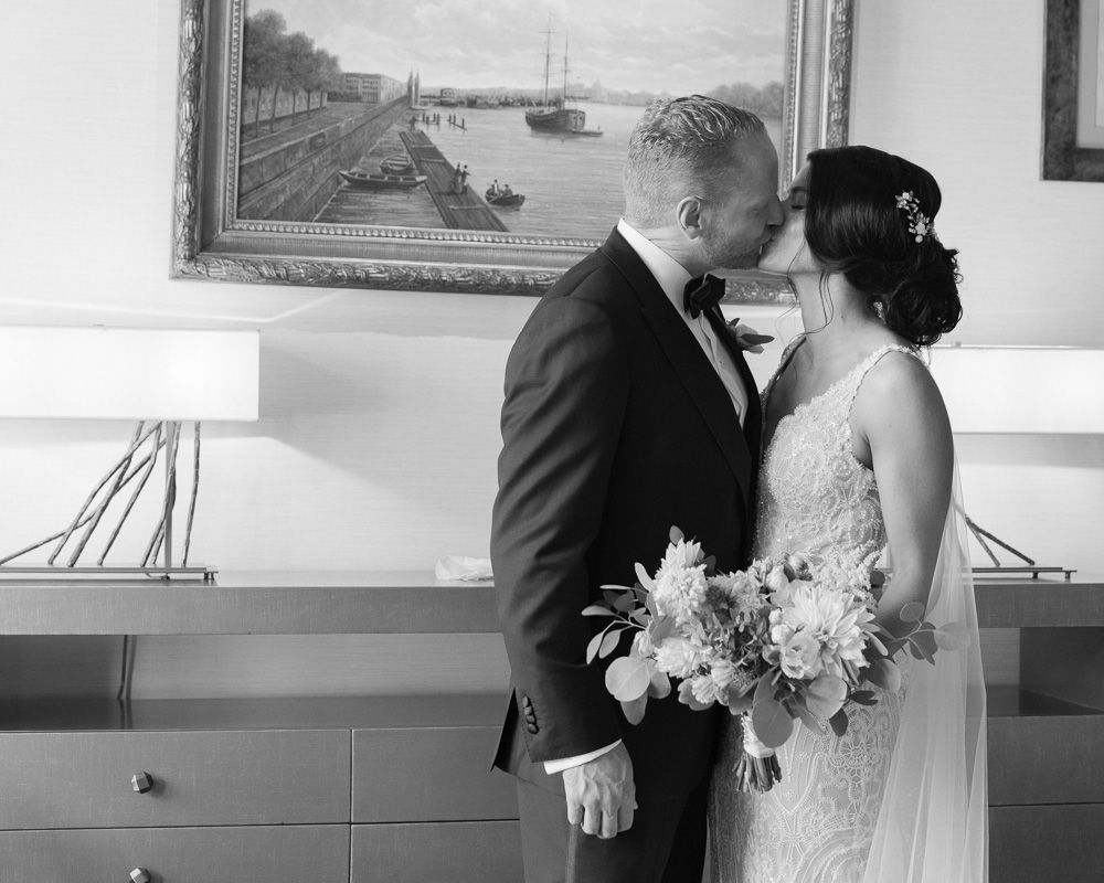 Elegant bride and groom share a kiss at the Bernards Inn in Bernardsville NJ by Laura Billingham Photography