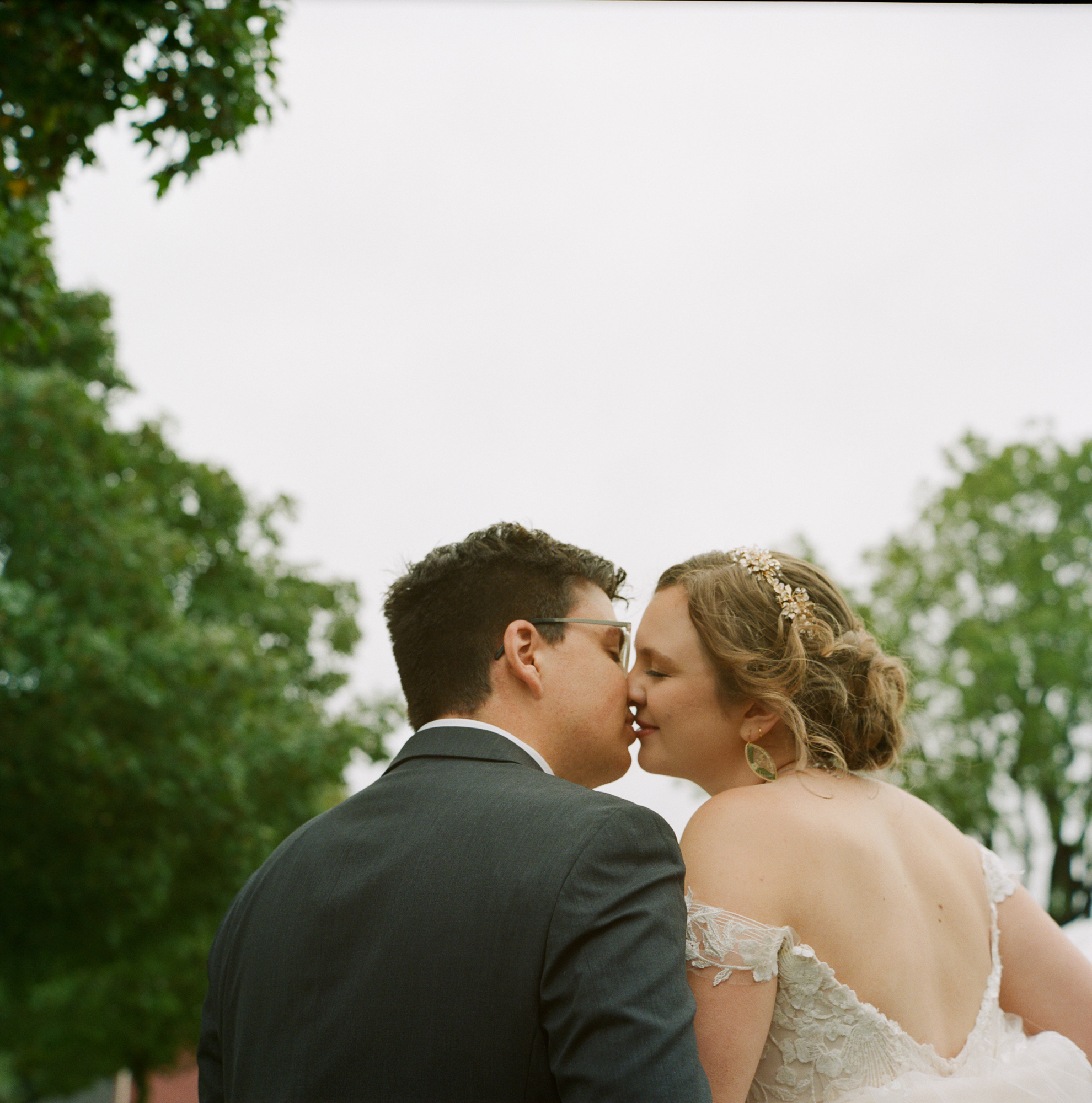 An elegant bride and groom share a kiss at their wedding reception at Suydam Farms in Somerset, NJ