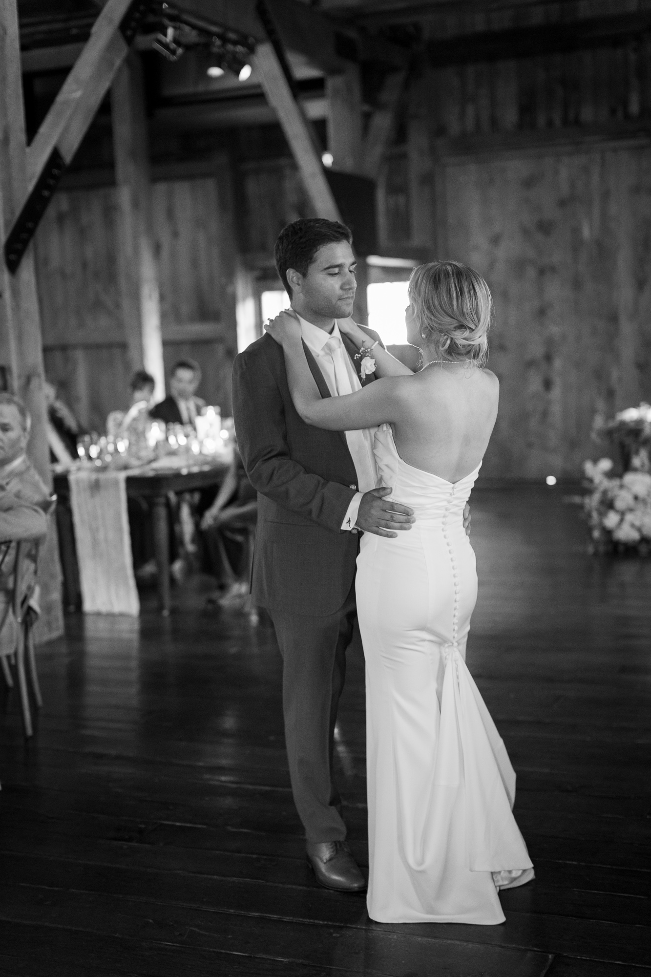 Elegant bride and groom share their first dance in the Barn at Farm at Eagles Ridge in Lancaster, PA