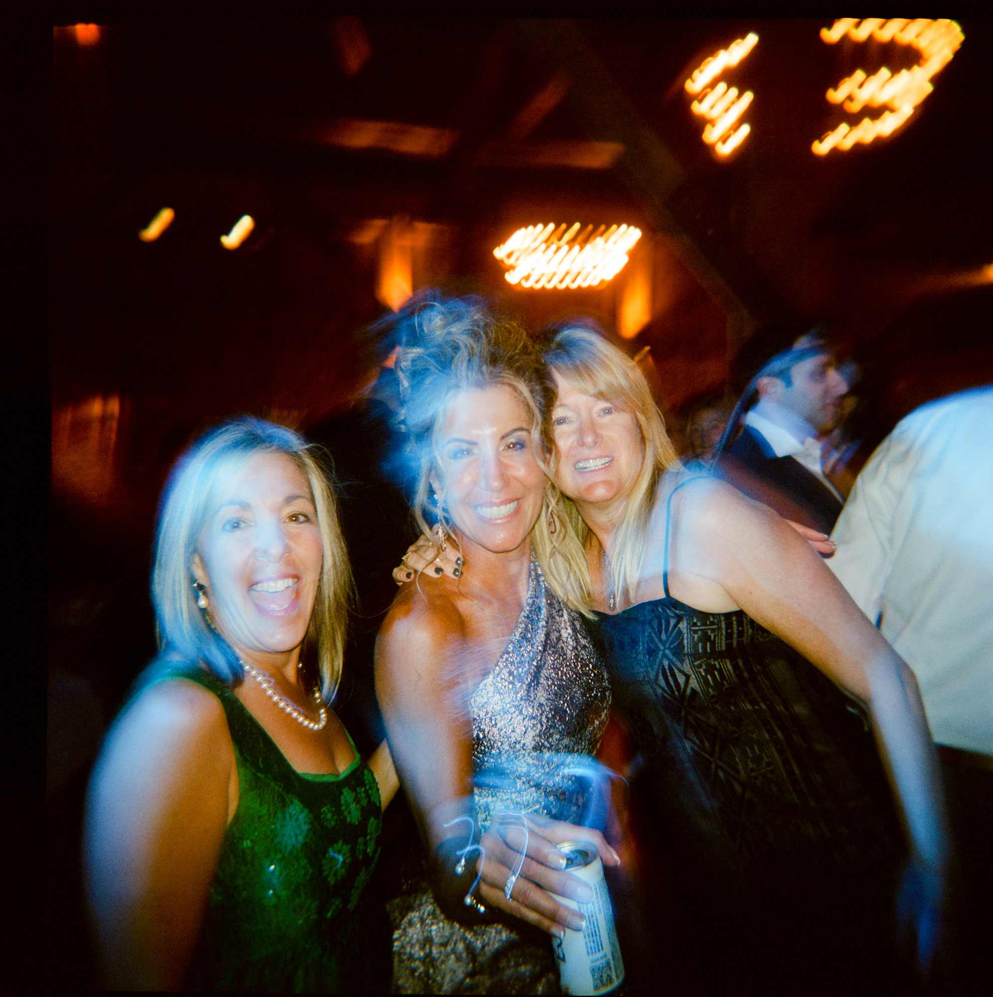 Group of friends taken with a Holga film camera at a wedding reception in the Barn at Farm at Eagles Ridge in Lancaster, PA