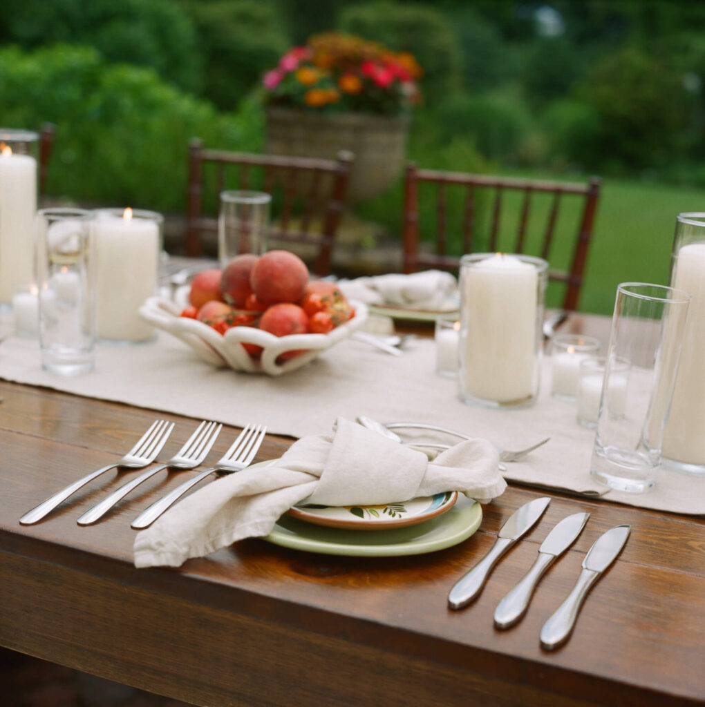 Film photograph detail shot of handmade ceramic plates and vessels at wedding reception