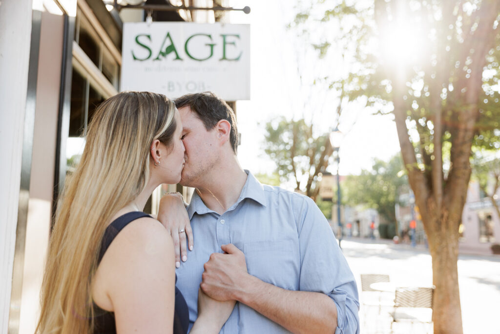 Authentic moment between Selah and Brendan during engagement session photographer's work at restaurant where they got engaged