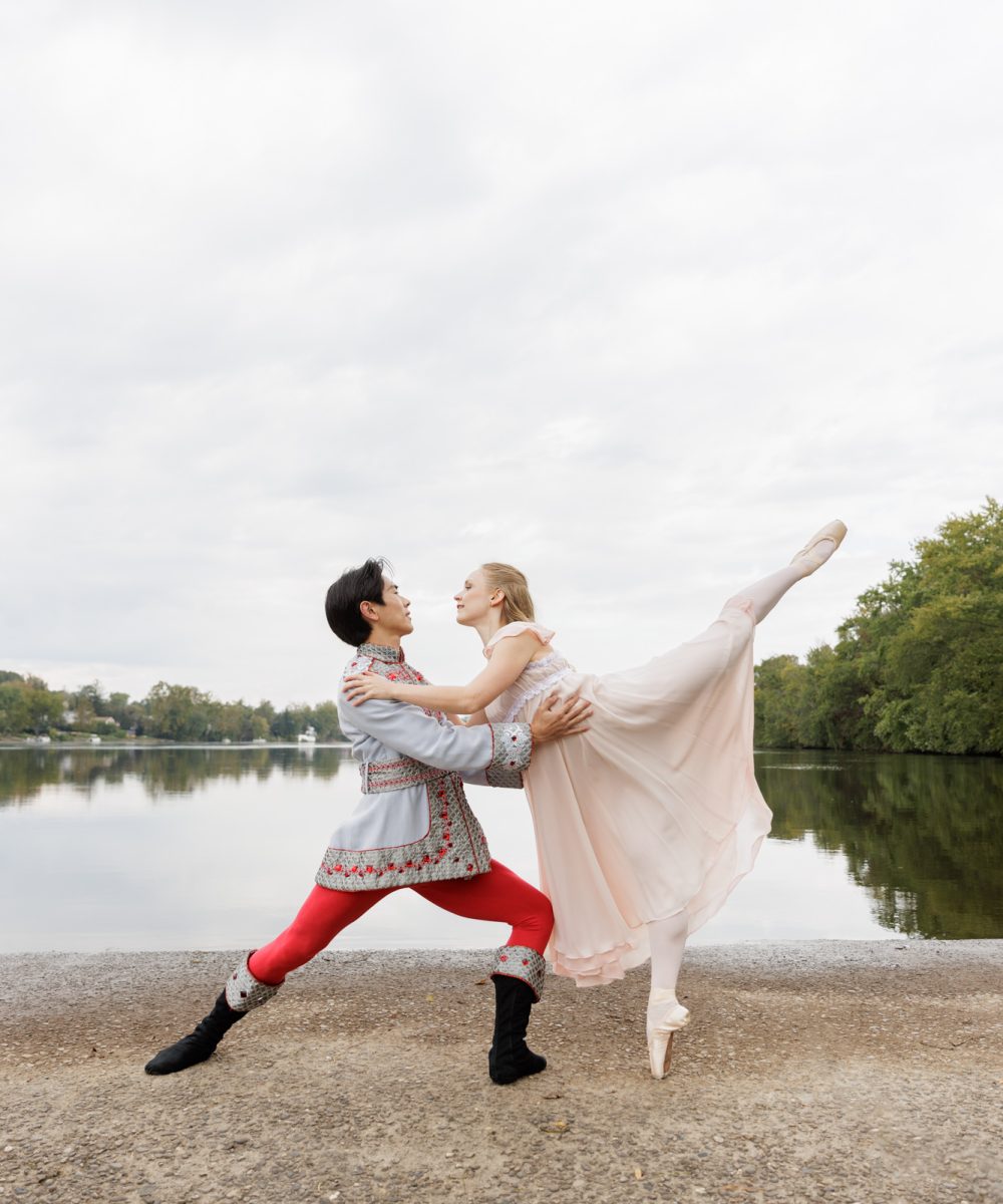 Two professional ballet dancers, Pinja Sinisalo and Kaito Kurokawa from Roxey Ballet in New Hope, PA strike a dramatic pose with the Delaware River behind them. This editorial photograph by Laura Billingham appeared in Issue 19 Winter 2023 of River Towns Magazine